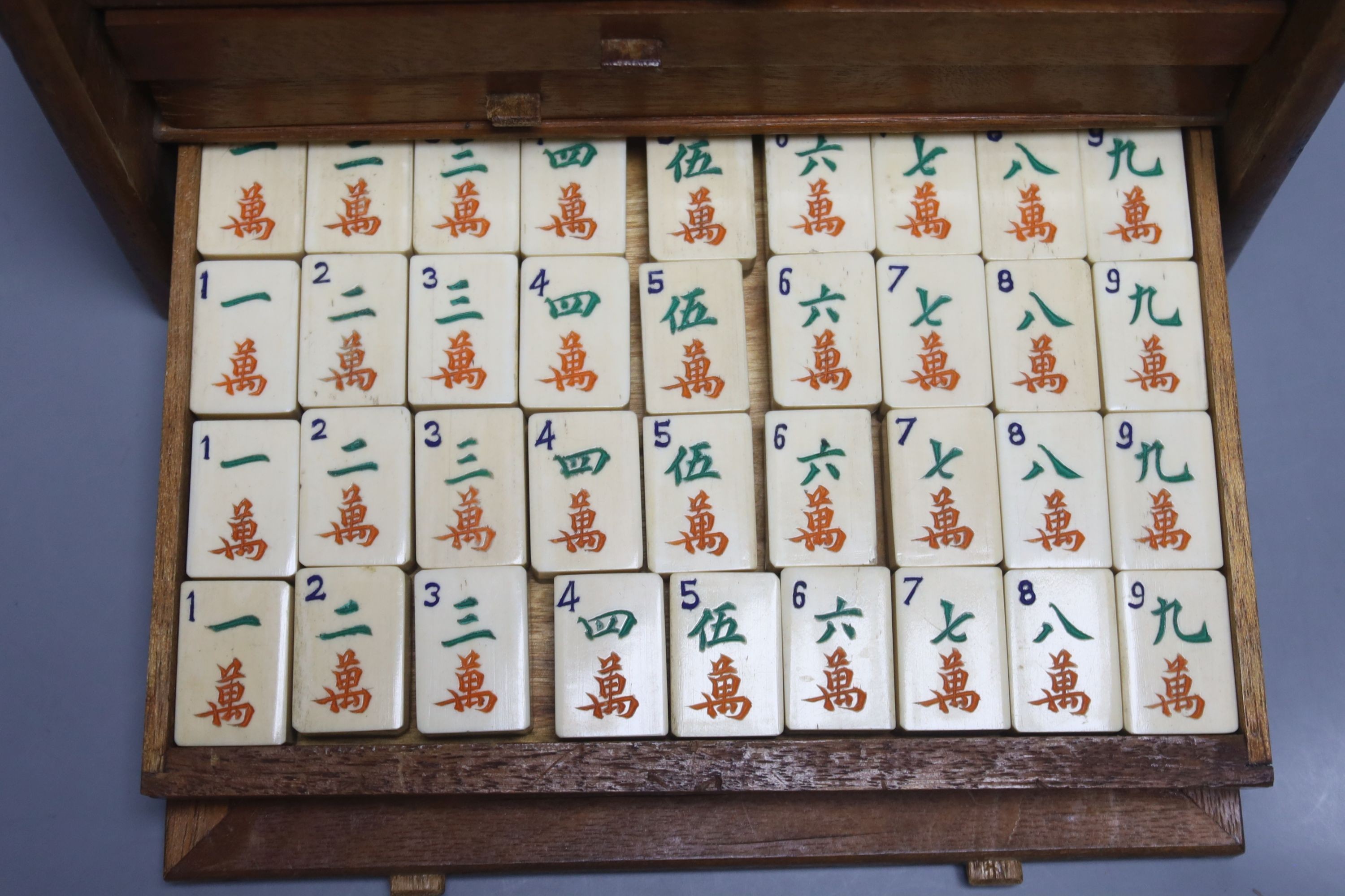 A Chinese hardwood cased mah jong set